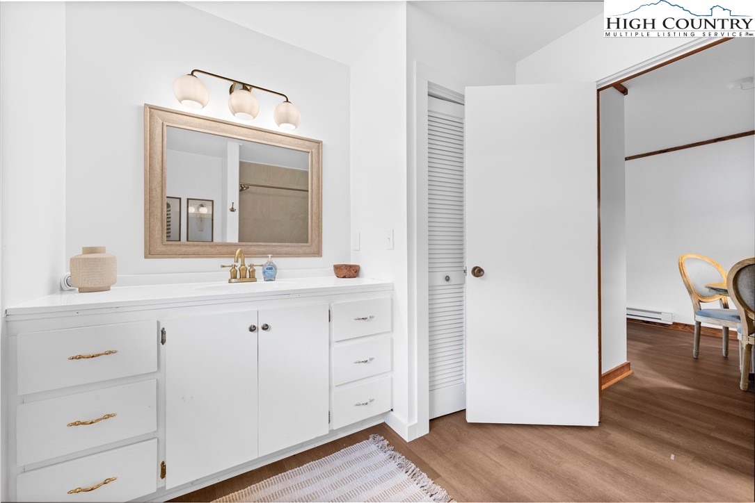 1044 Highway 321 Vilas, NC 28692 - Photo 44 of 47 a bathroom with a double vanity sink and mirror