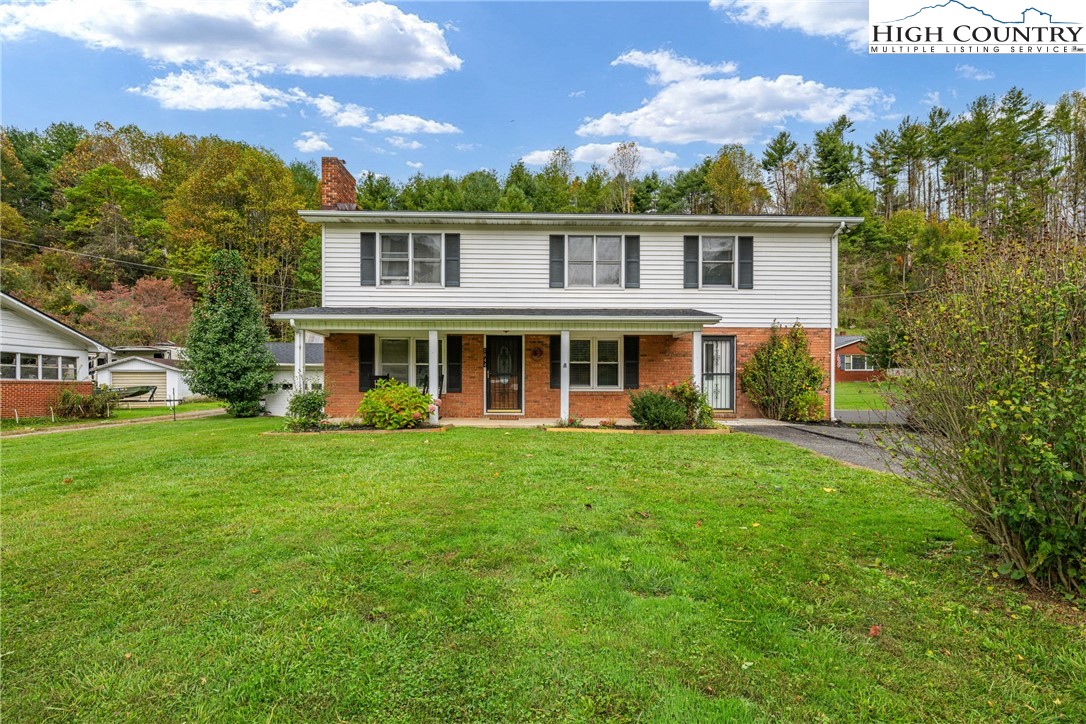 1044 Highway 321 Vilas, NC 28692 - Photo 9 of 47 a front view of a house with a yard