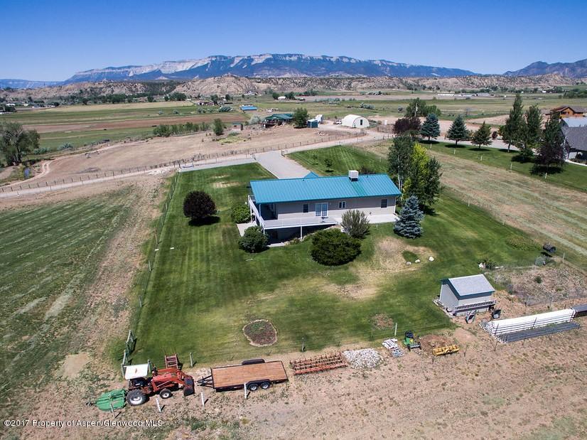 2989 County Road 210 Rifle, CO 81650 - Photo 3 of 22 an aerial view of a house with a garden