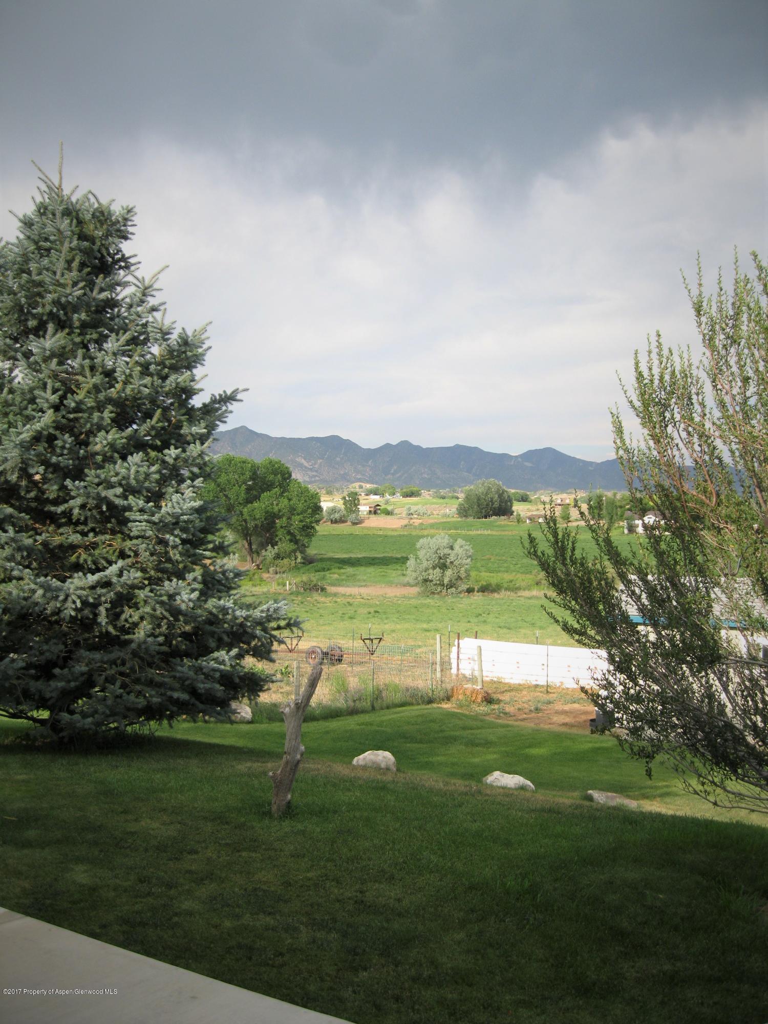 2989 County Road 210 Rifle, CO 81650 - Photo 7 of 22 a view of a lake with a big yard
