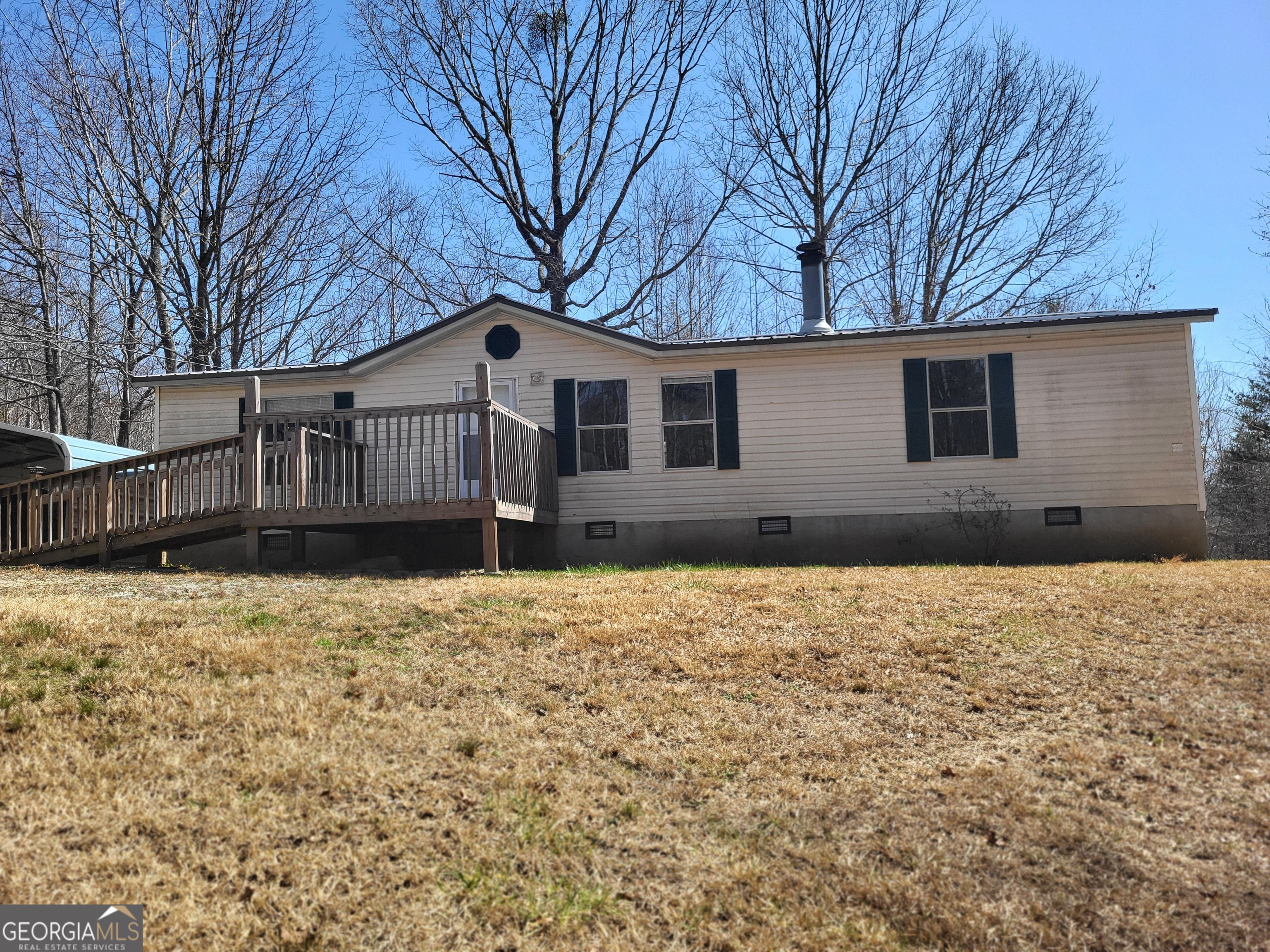 1612 North Hicks Road Toccoa, GA 30577 - Photo 1 of 1 a house with trees in front of it