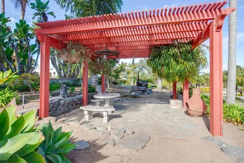 a view of a backyard with sitting area
