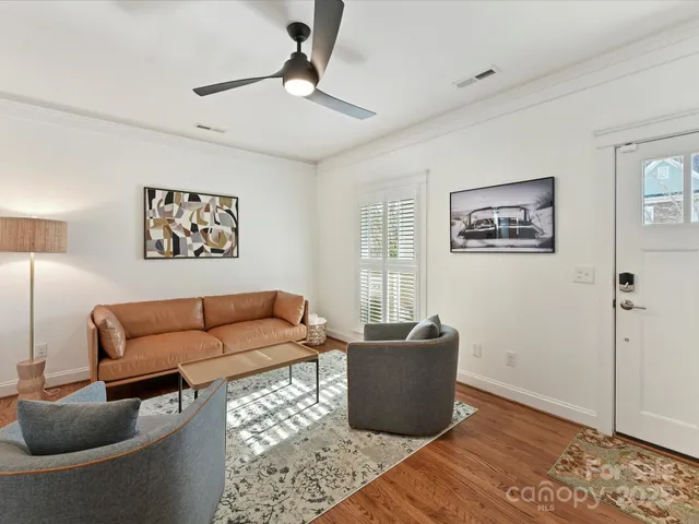 a living room with furniture rug and window