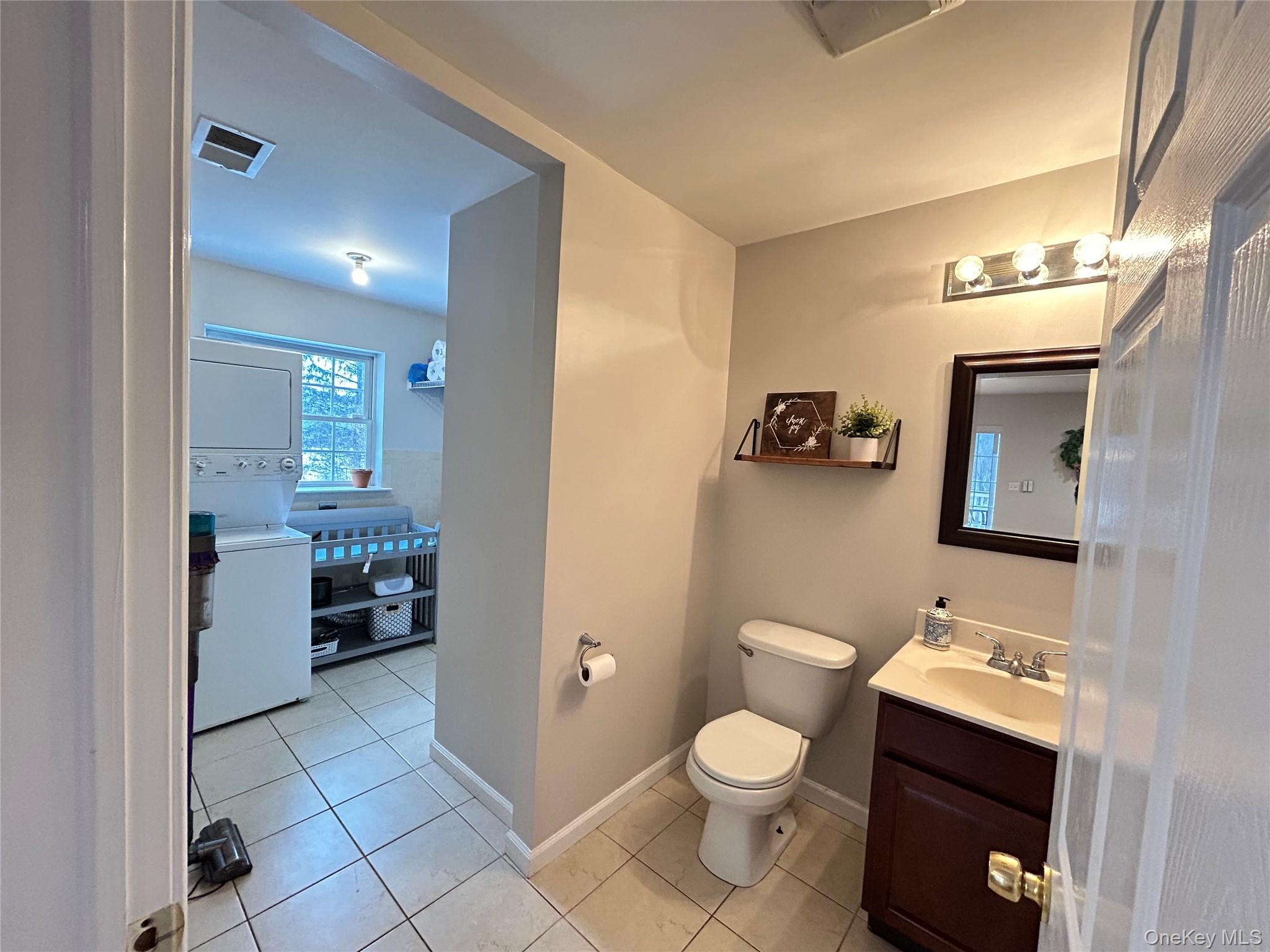 53 Daly Road Middletown, NY 10940 - Photo 11 of 27 a bathroom with a toilet sink and mirror