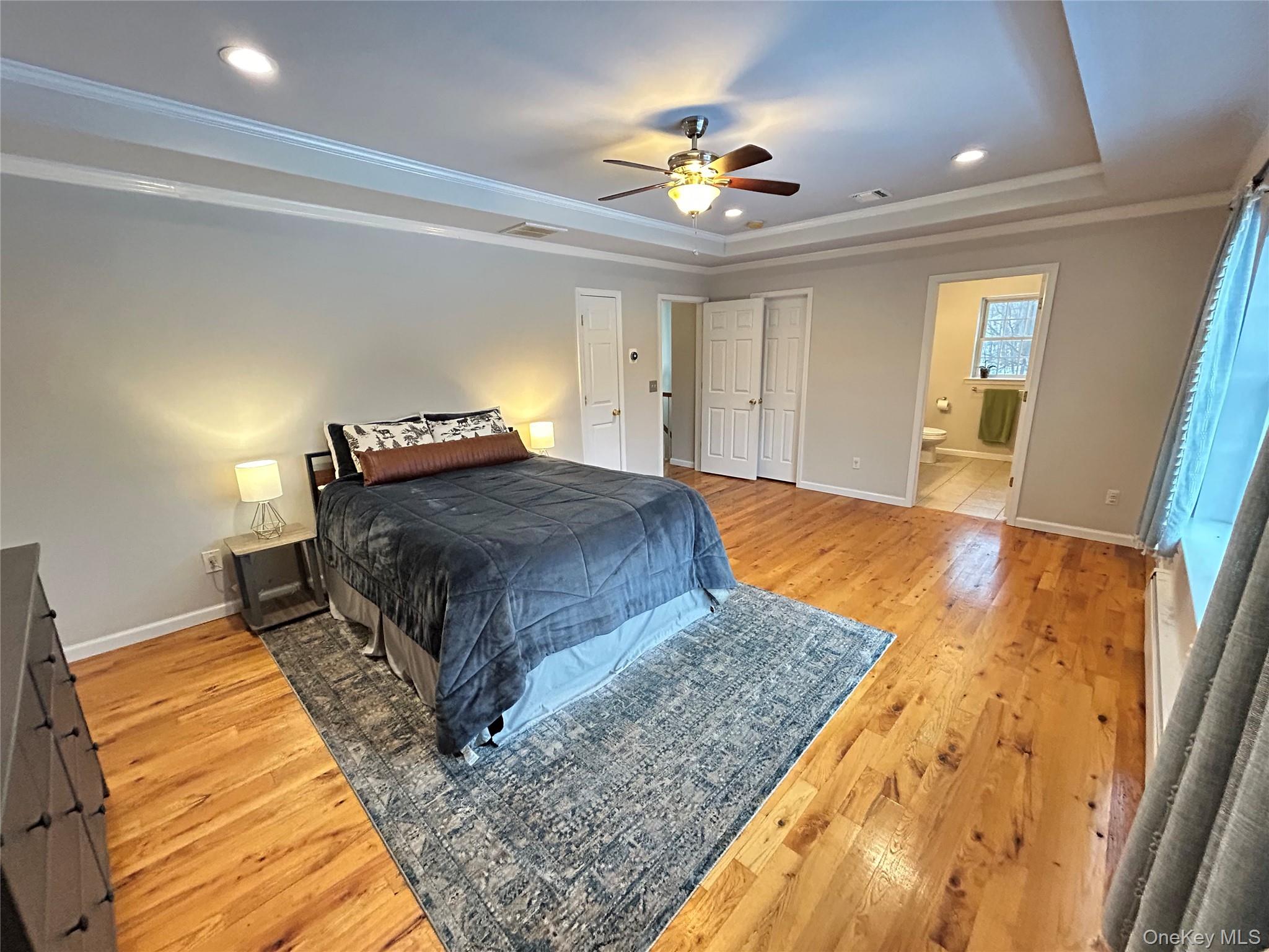 53 Daly Road Middletown, NY 10940 - Photo 14 of 27 a bedroom with a bed and a chandelier