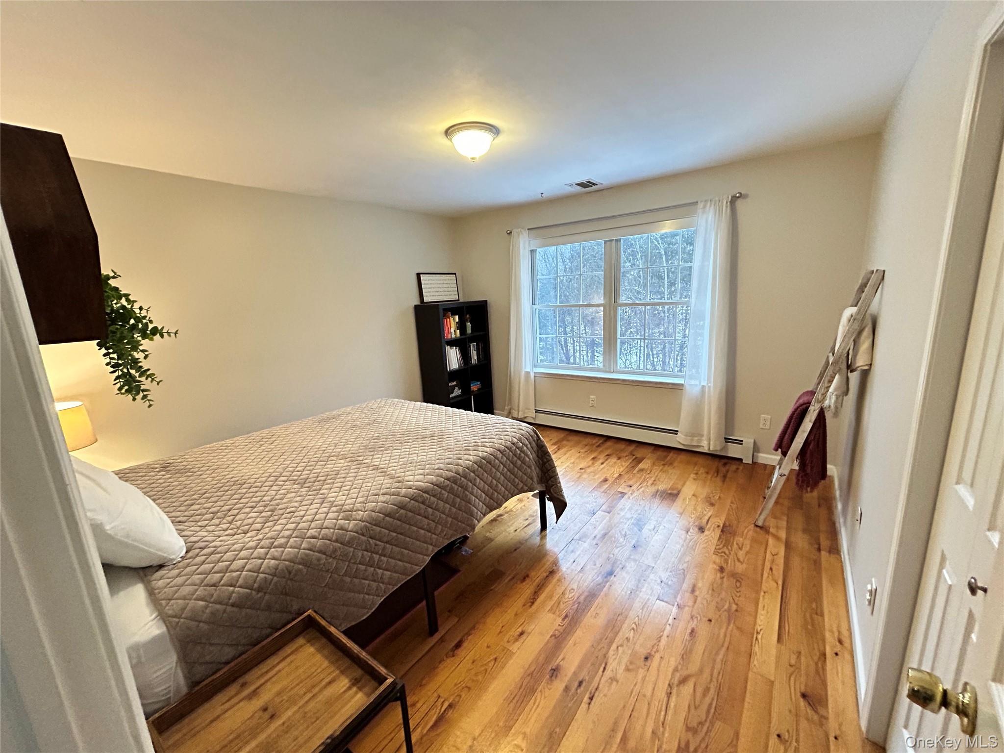 53 Daly Road Middletown, NY 10940 - Photo 16 of 27 a bed sitting in a bedroom next to a window