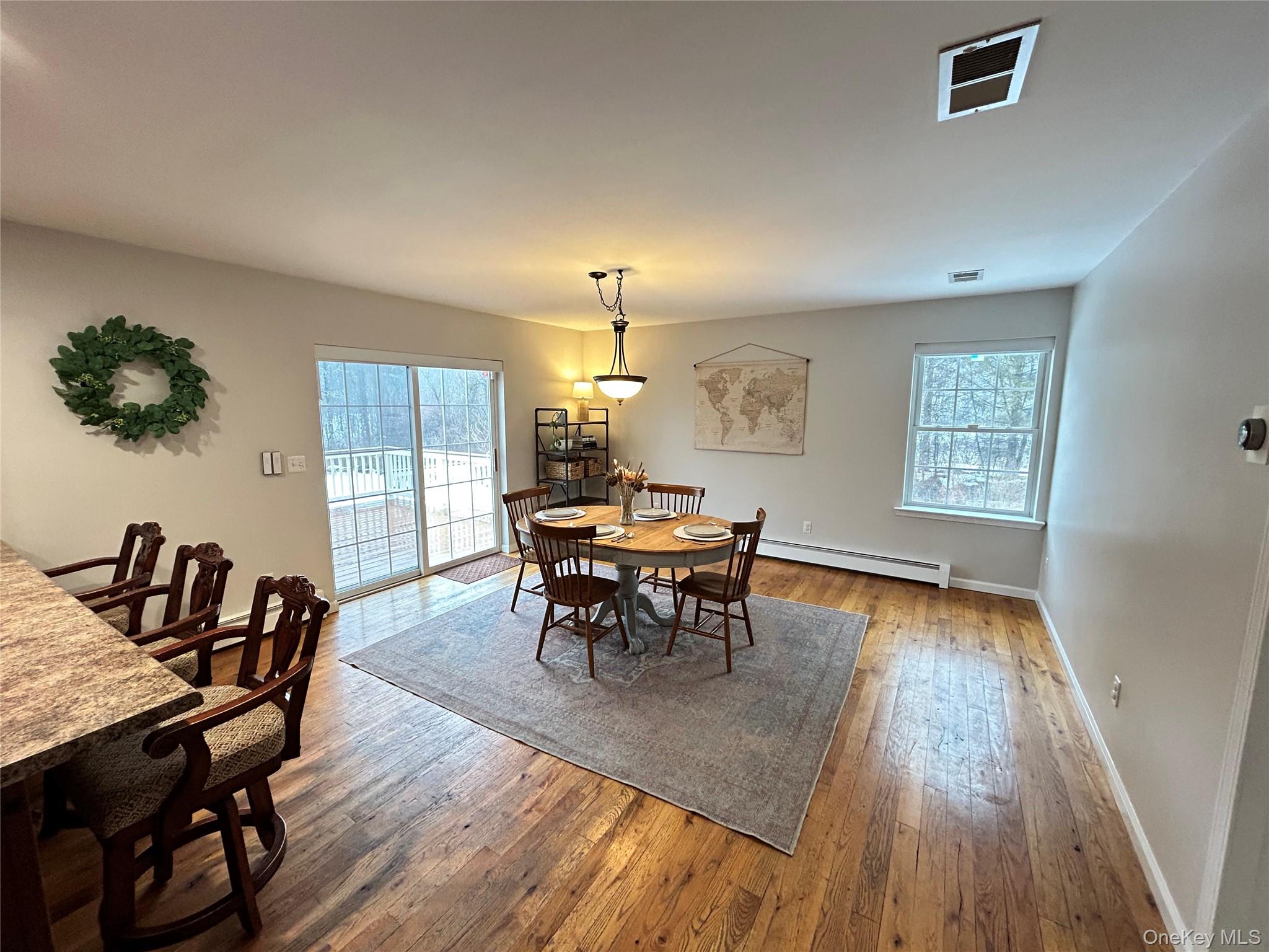 53 Daly Road Middletown, NY 10940 - Photo 10 of 27 a view of a dining room with furniture and wooden floor
