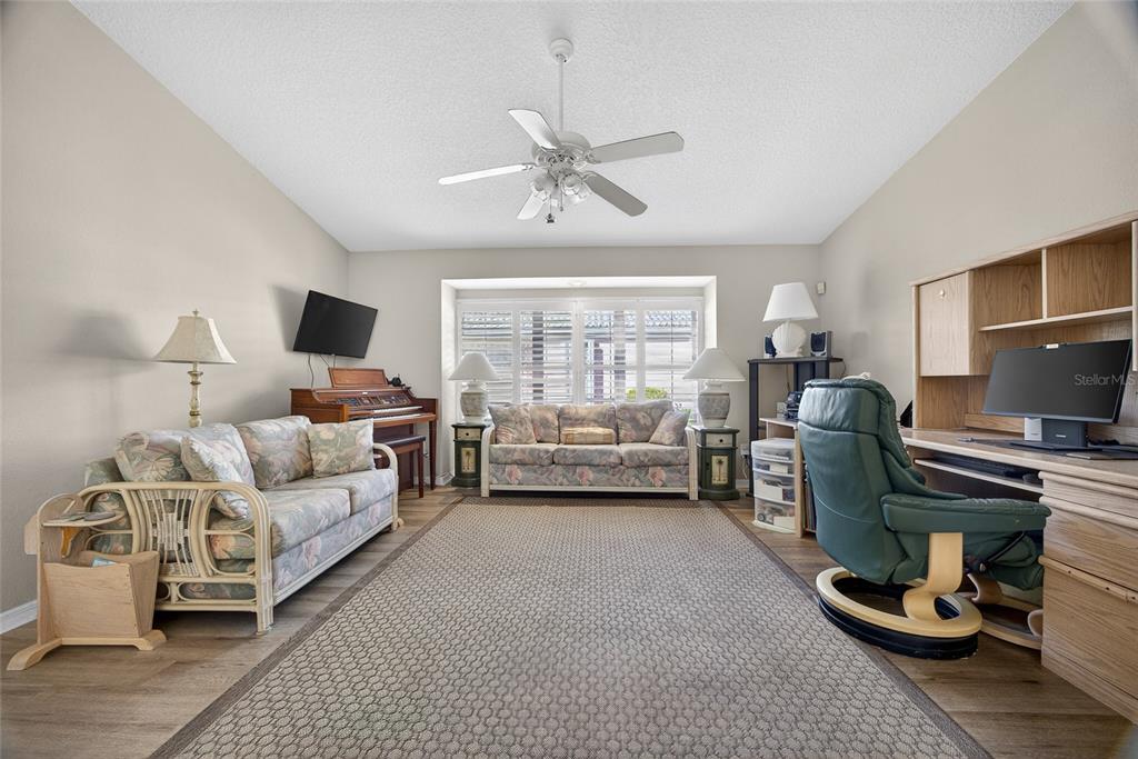 1421 Rio De Janeiro Avenue Punta Gorda, FL 33983 - Photo 11 of 34 a living room with furniture and a flat screen tv