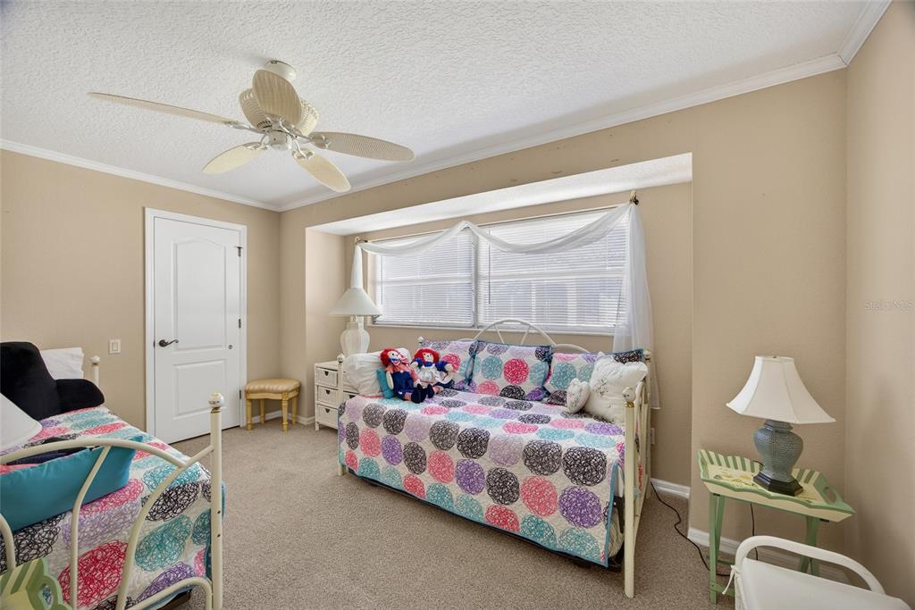 1421 Rio De Janeiro Avenue Punta Gorda, FL 33983 - Photo 18 of 34 a bedroom with a bed and window