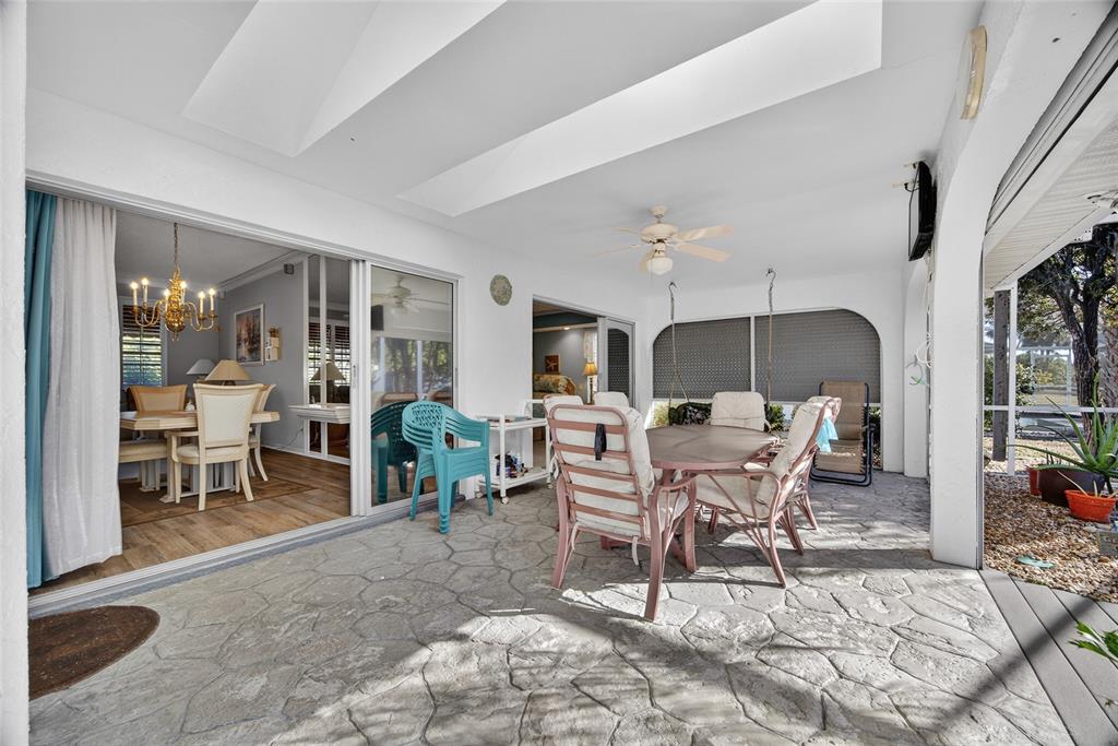 1421 Rio De Janeiro Avenue Punta Gorda, FL 33983 - Photo 22 of 34 a living room with furniture a window and a table