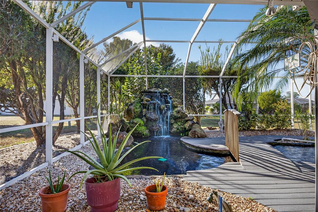 1421 Rio De Janeiro Avenue Punta Gorda, FL 33983 - Photo 23 of 34 a potted plant sitting on a wooden floor