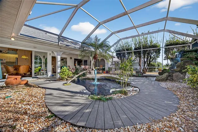 a view of a swimming pool with sitting area