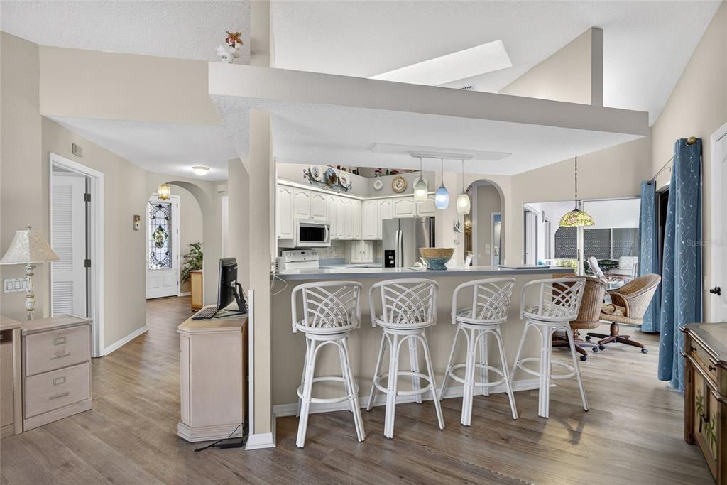 1421 Rio De Janeiro Avenue Punta Gorda, FL 33983 - Photo 7 of 34 a view of a dining room with furniture and wooden floor