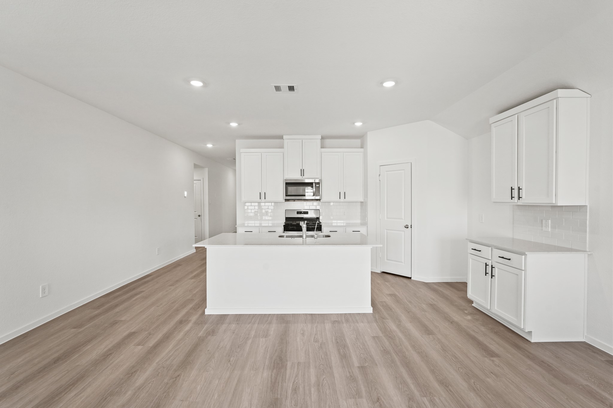 541 Wax Myrtle Way Hockley, TX 77447 - Photo 4 of 19 a view of kitchen with wooden floor and electronic appliances
