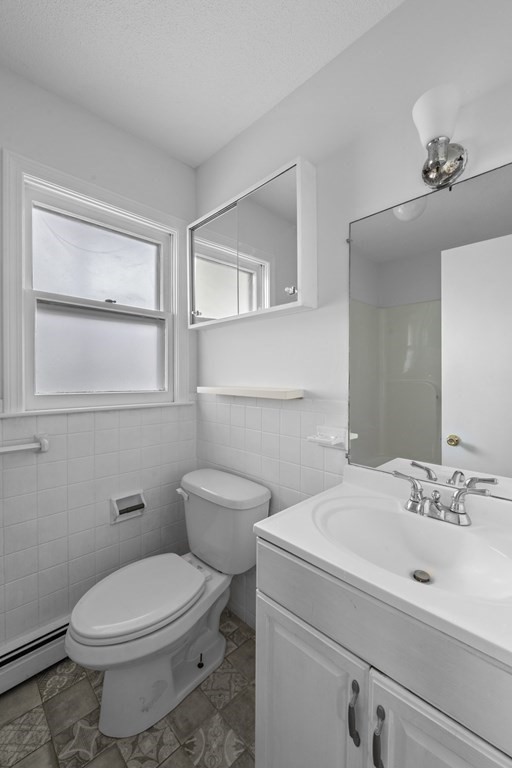 47 Cedar Street Malden, MA 02148 - Photo 12 of 24 a bathroom with a toilet sink and mirror