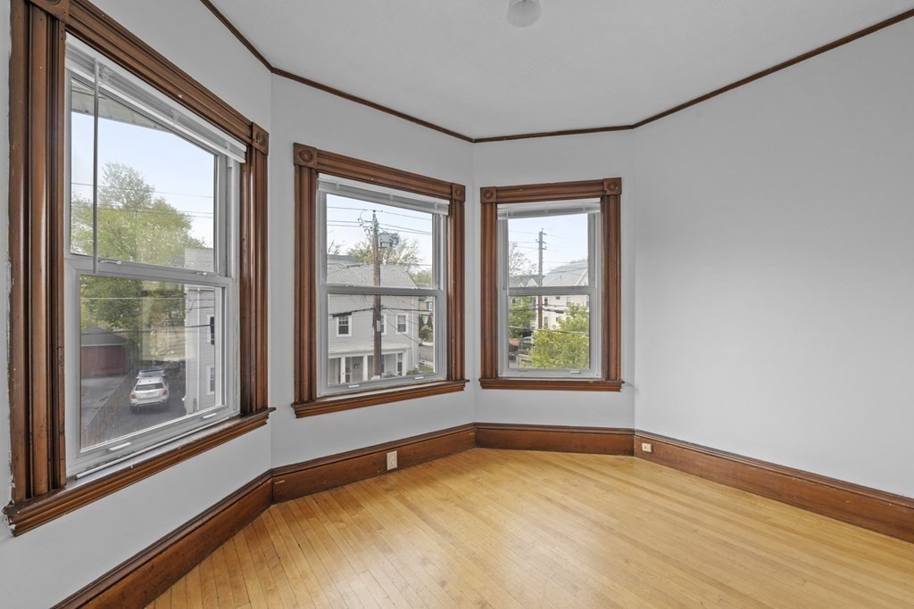 47 Cedar Street Malden, MA 02148 - Photo 18 of 24 a view of an empty room with a window