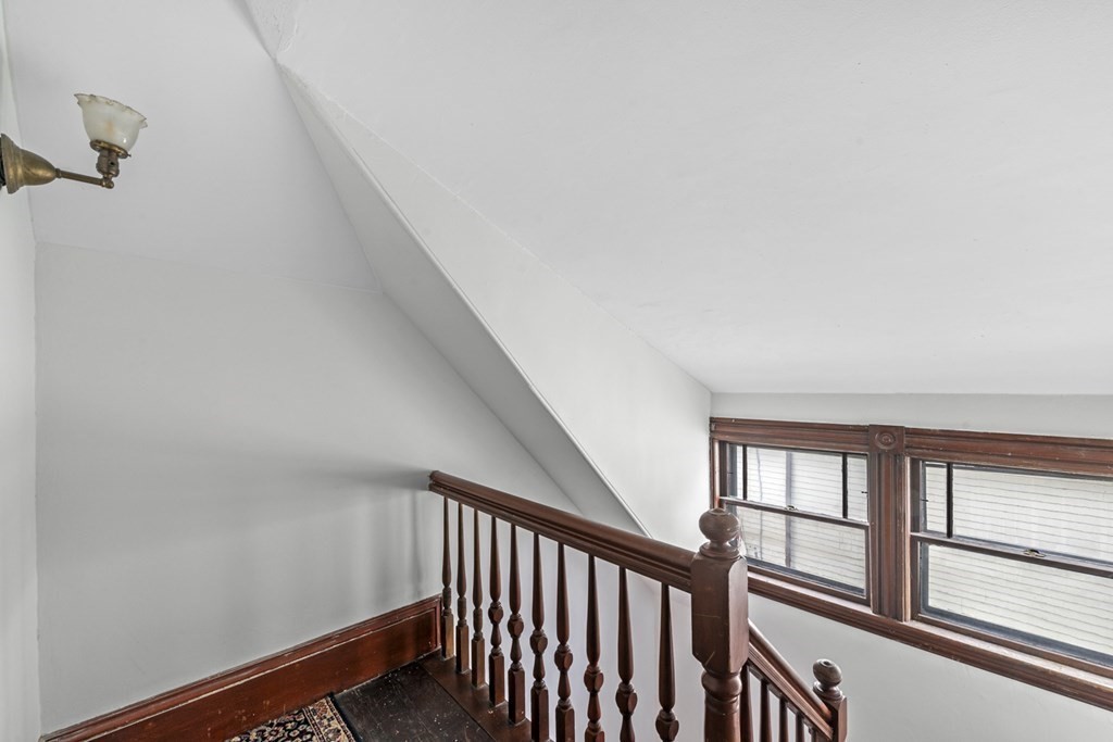 47 Cedar Street Malden, MA 02148 - Photo 20 of 24 a view of a hallway with windows