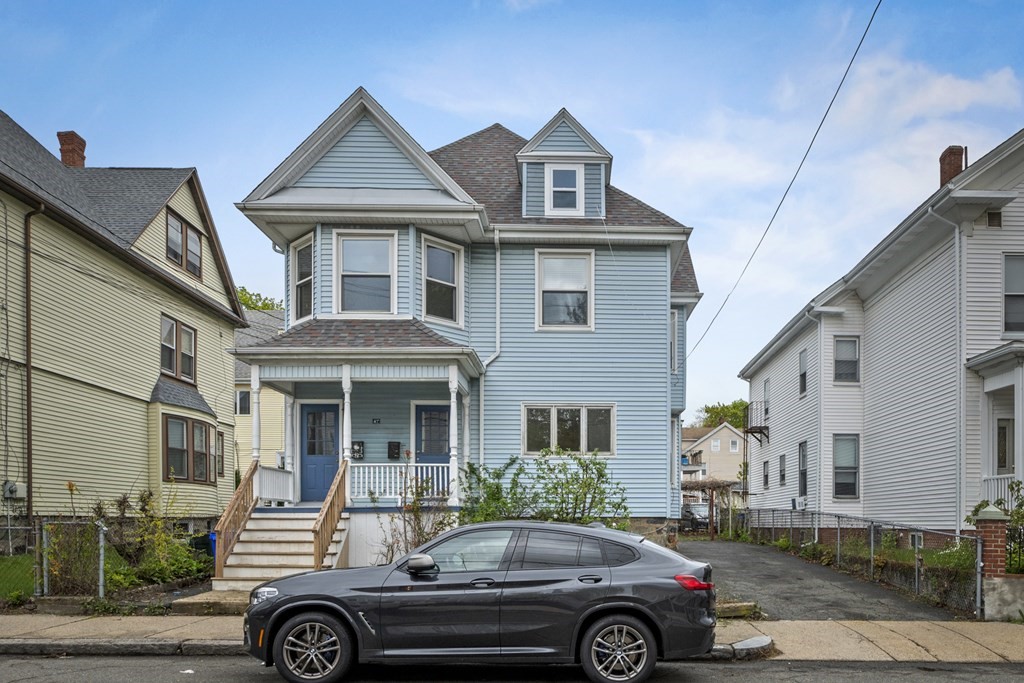 47 Cedar Street Malden, MA 02148 - Photo 2 of 24 a front view of a house with parking space
