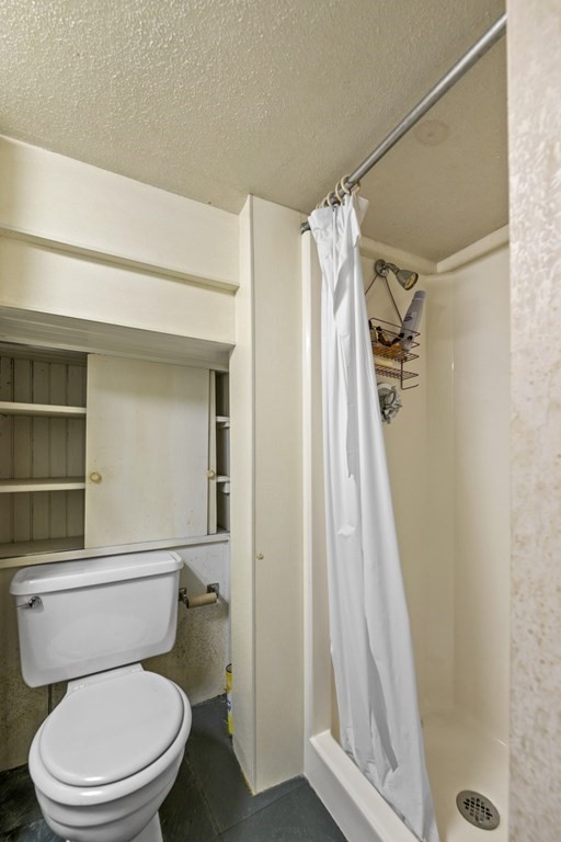 47 Cedar Street Malden, MA 02148 - Photo 24 of 24 a white toilet sitting next to a shower