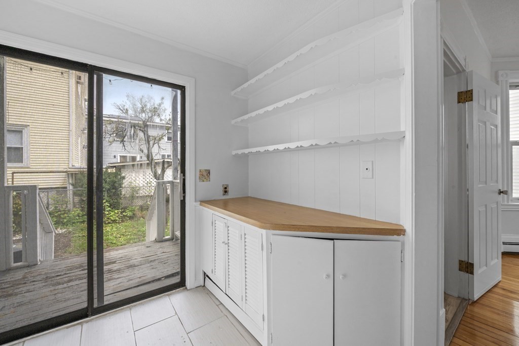 47 Cedar Street Malden, MA 02148 - Photo 7 of 24 a utility room with sliding door and mountain view