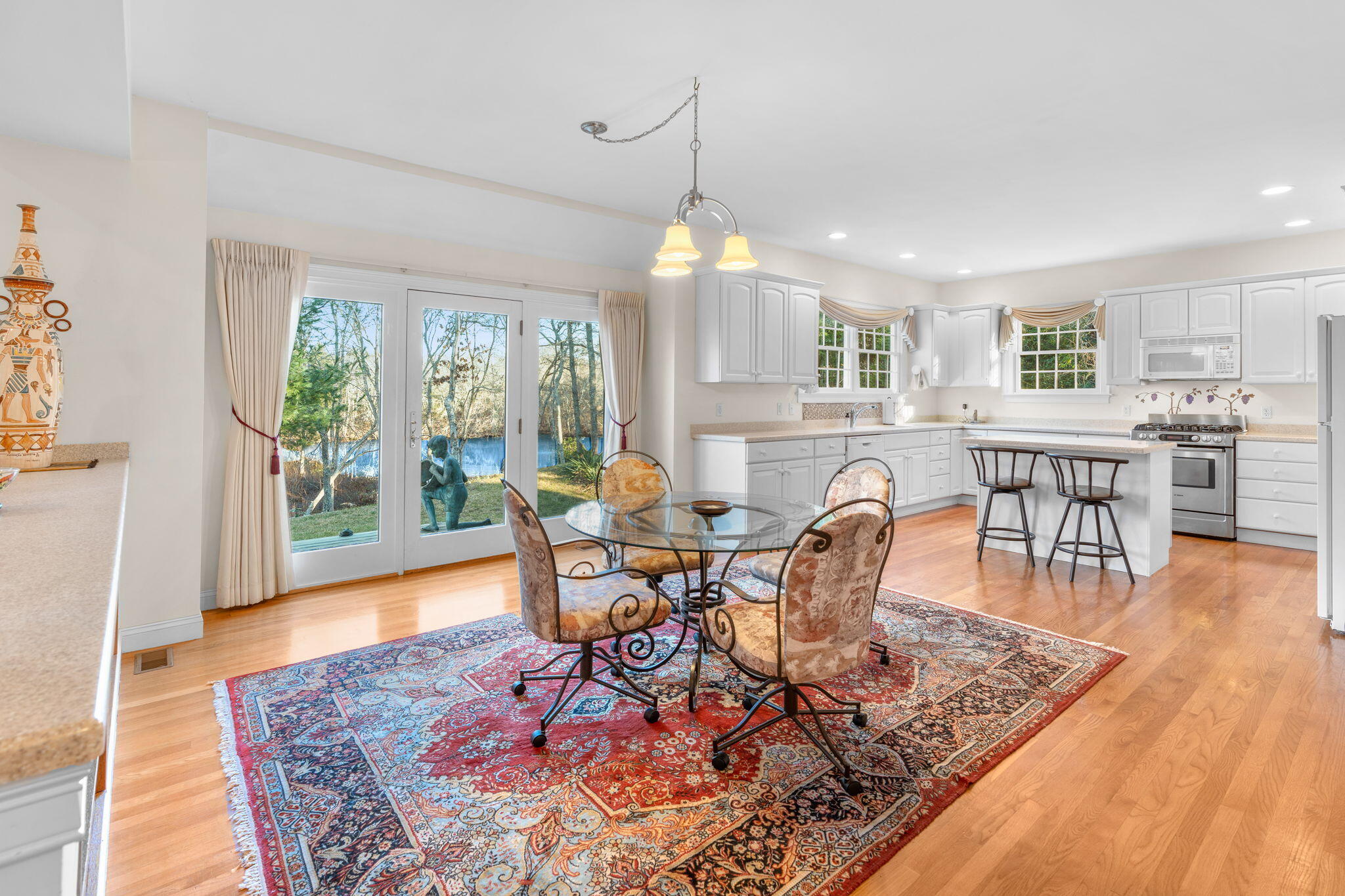 208 Rock Landing Road Mashpee, MA 02649 - Photo 14 of 32 a view of a dining room with furniture window and wooden floor