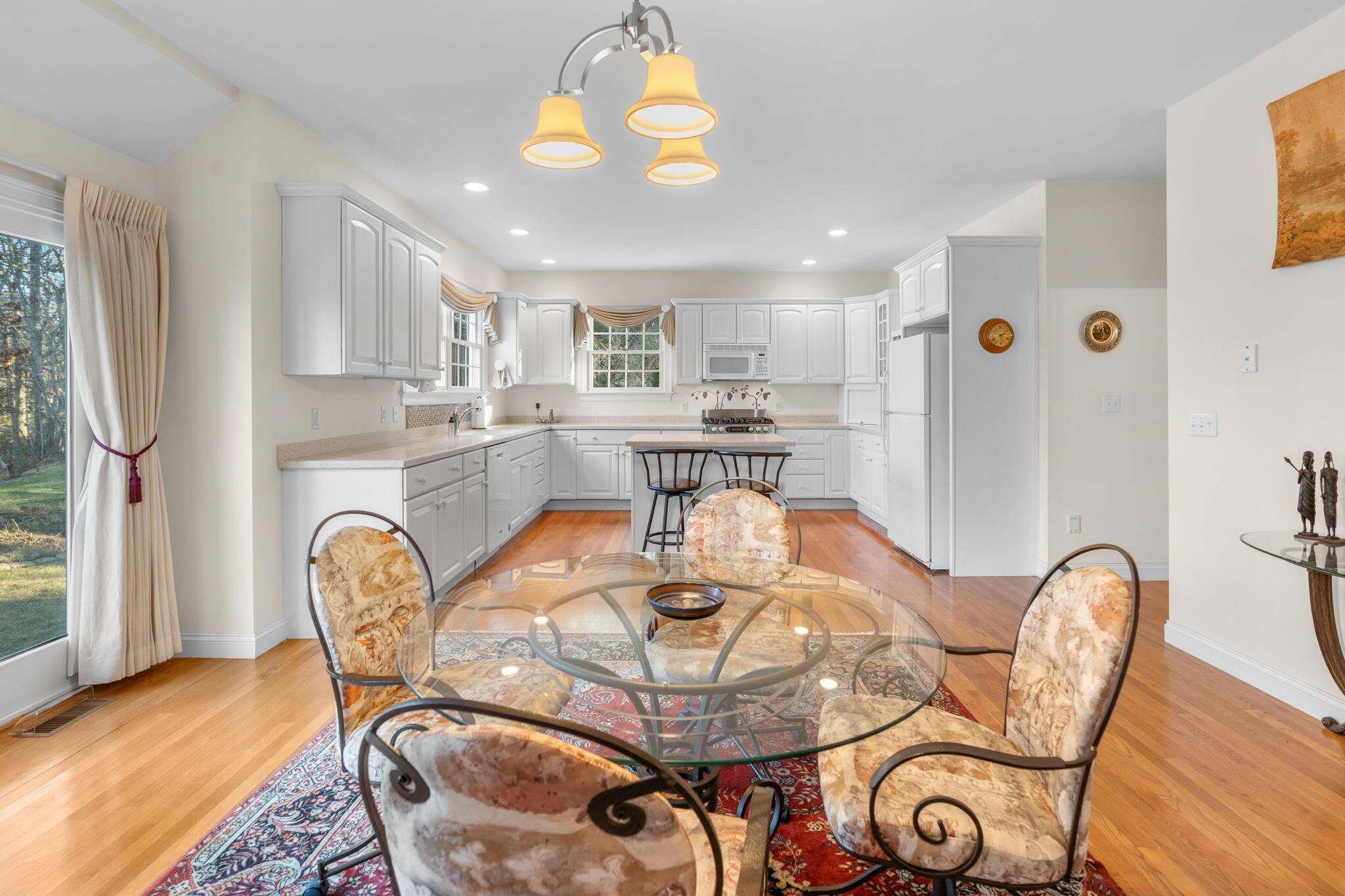 208 Rock Landing Road Mashpee, MA 02649 - Photo 15 of 32 a view of a dining room with furniture window and wooden floor