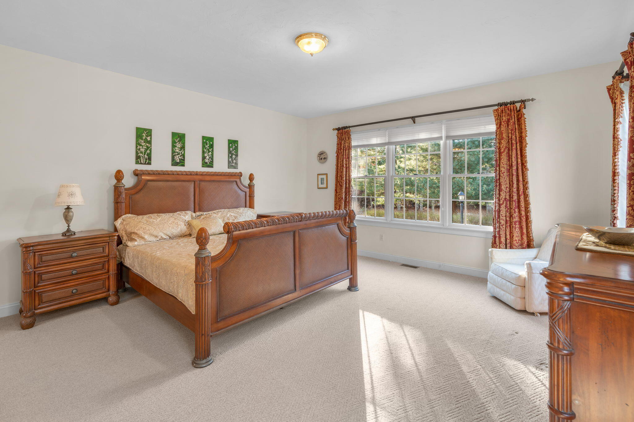 208 Rock Landing Road Mashpee, MA 02649 - Photo 19 of 32 a bedroom with a bed and a night stand
