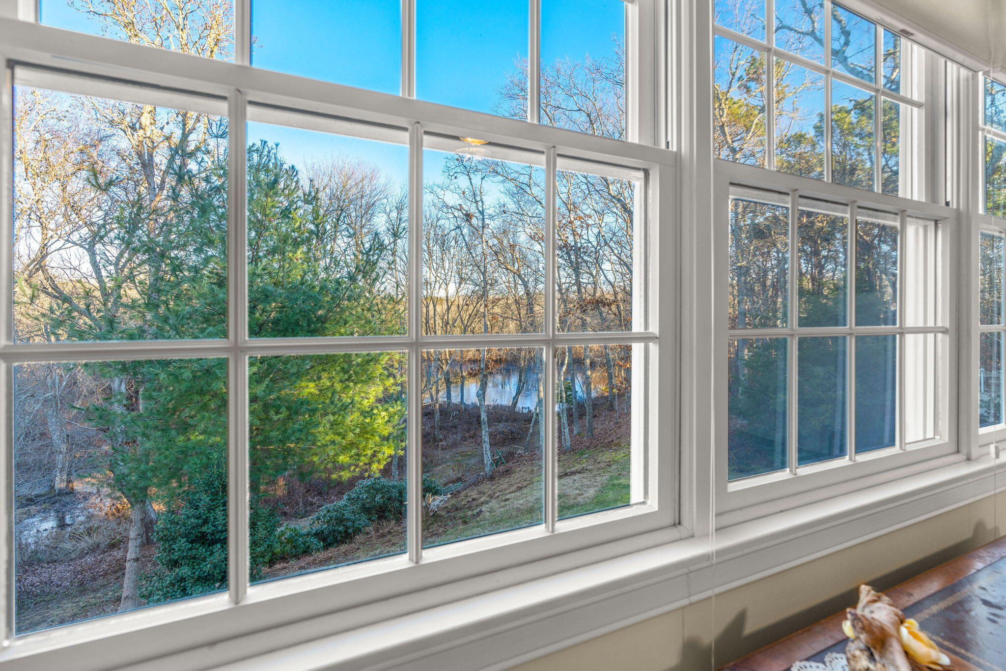 208 Rock Landing Road Mashpee, MA 02649 - Photo 22 of 32 a view of a room with a large window and wooden floor