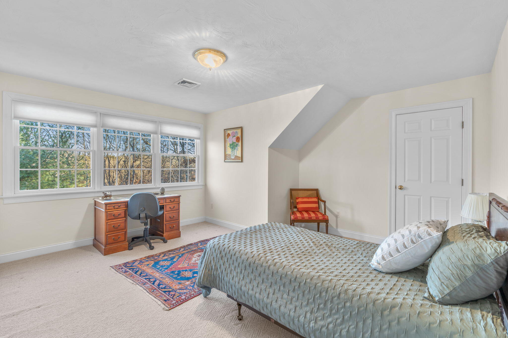 208 Rock Landing Road Mashpee, MA 02649 - Photo 23 of 32 a bedroom with a bed and a large window