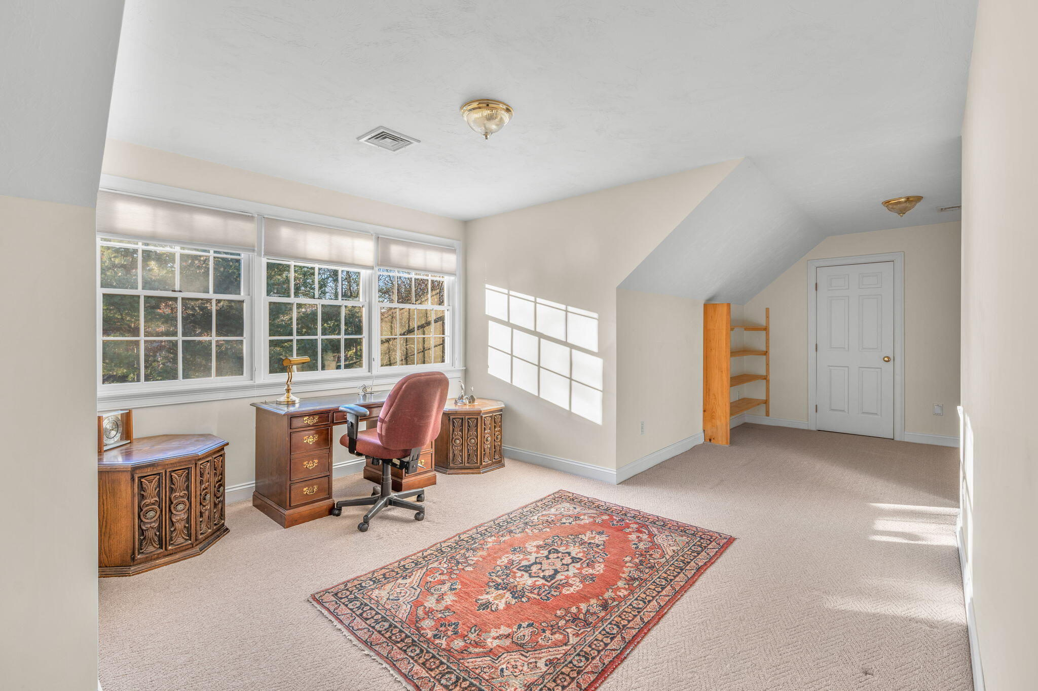 208 Rock Landing Road Mashpee, MA 02649 - Photo 24 of 32 a view of a workspace with furniture and a window