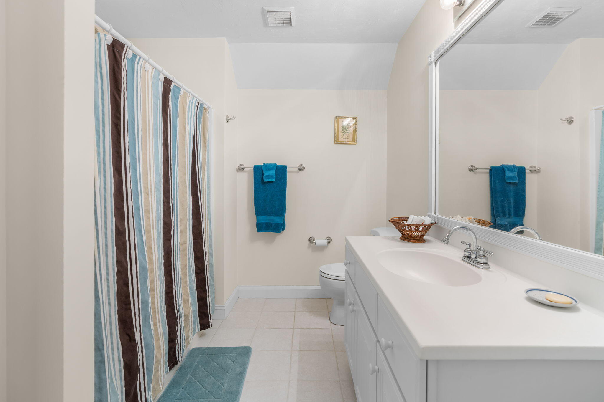 208 Rock Landing Road Mashpee, MA 02649 - Photo 25 of 32 a bathroom with a sink a toilet and mirror