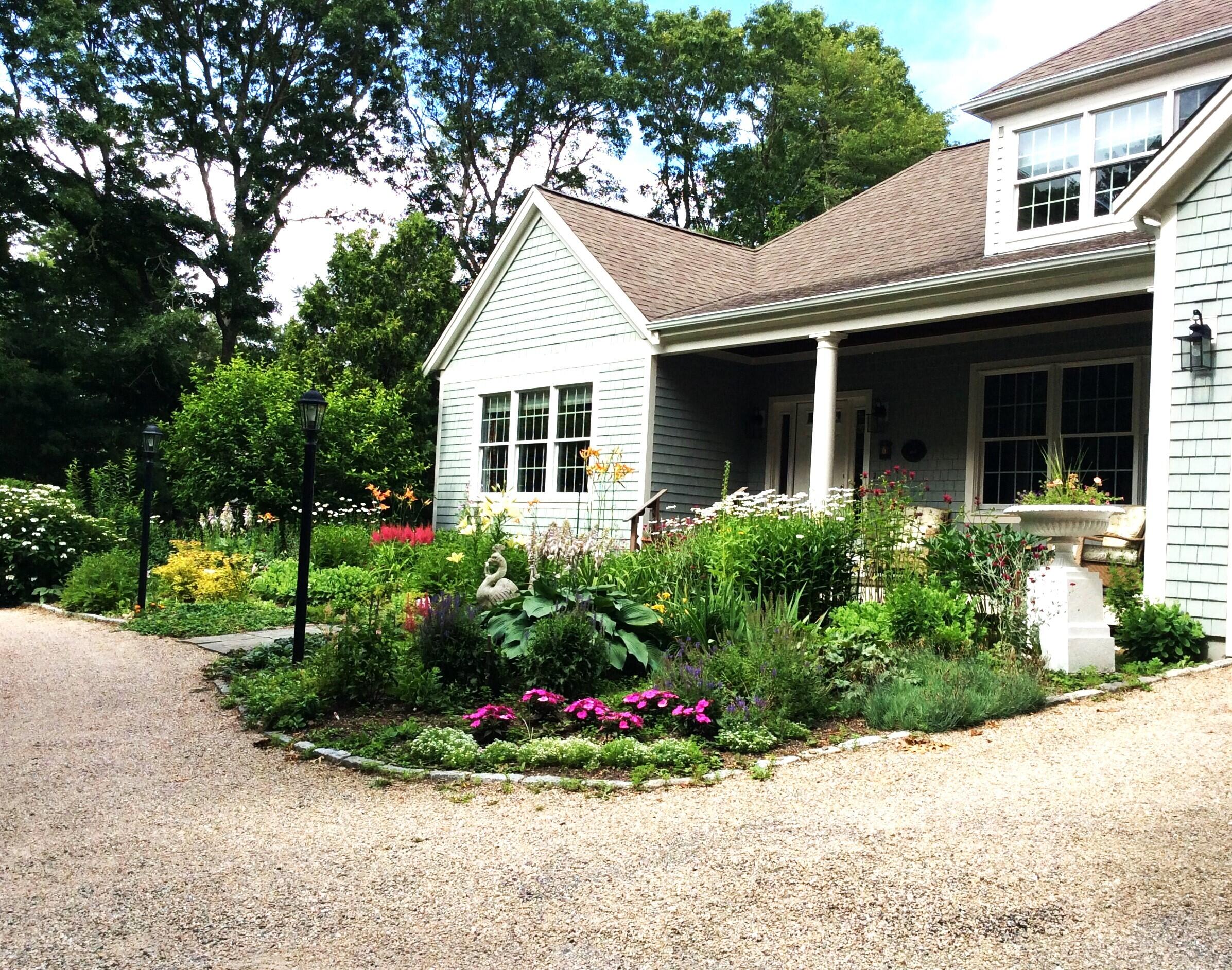 208 Rock Landing Road Mashpee, MA 02649 - Photo 27 of 32 a view of a house with a yard