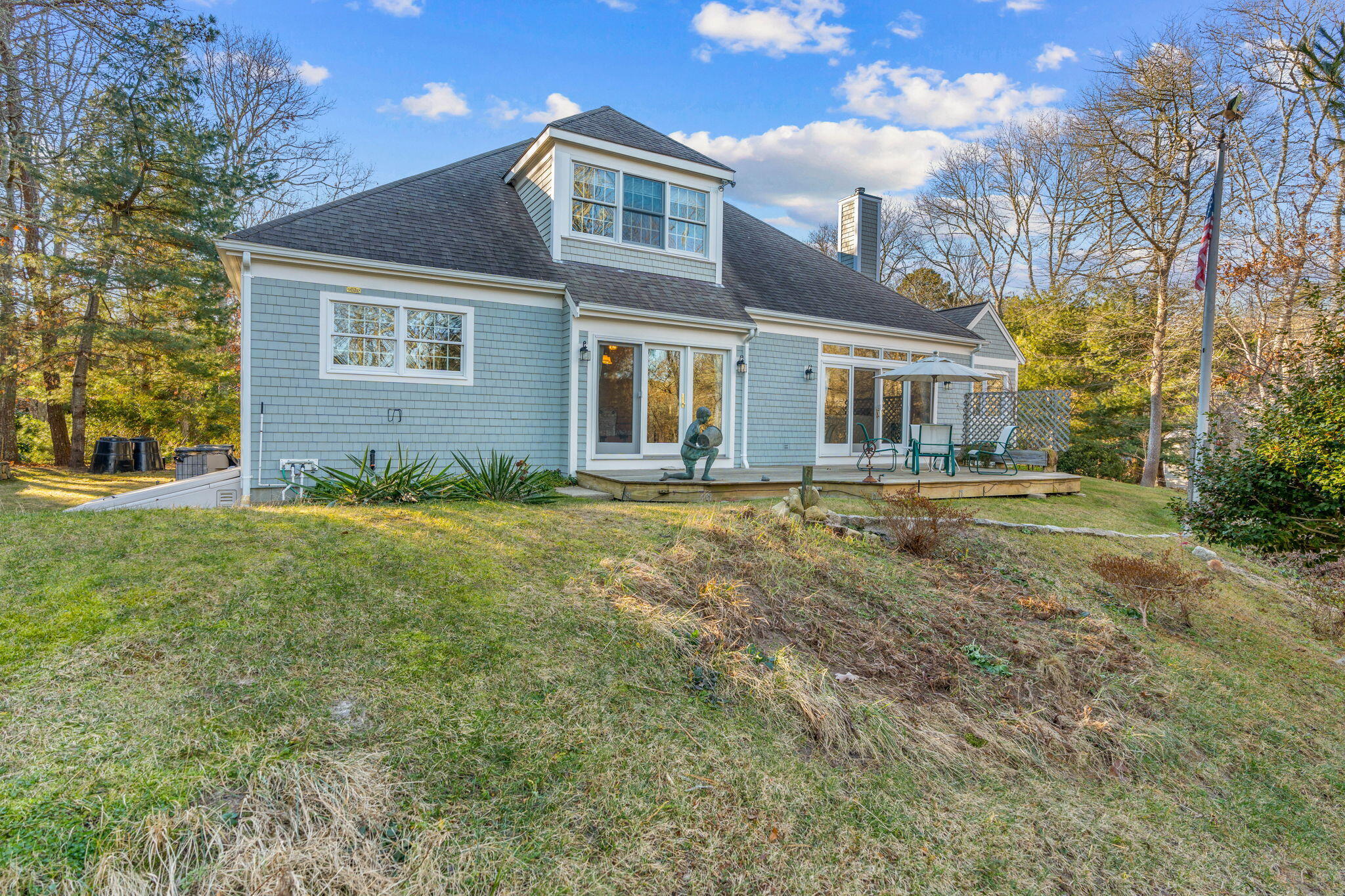 208 Rock Landing Road Mashpee, MA 02649 - Photo 29 of 32 a front view of a house with a yard