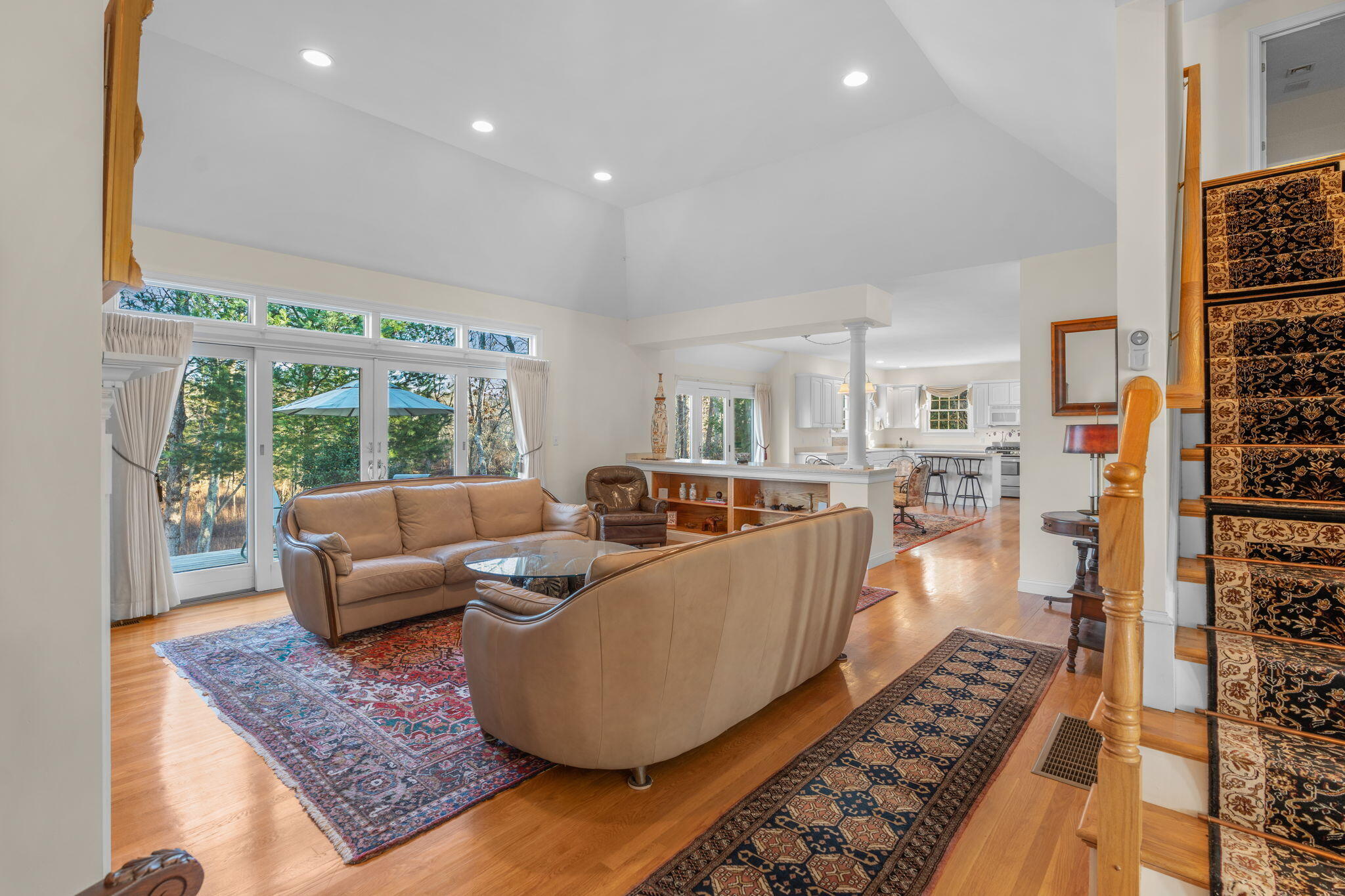 208 Rock Landing Road Mashpee, MA 02649 - Photo 9 of 32 a living room with furniture and a rug