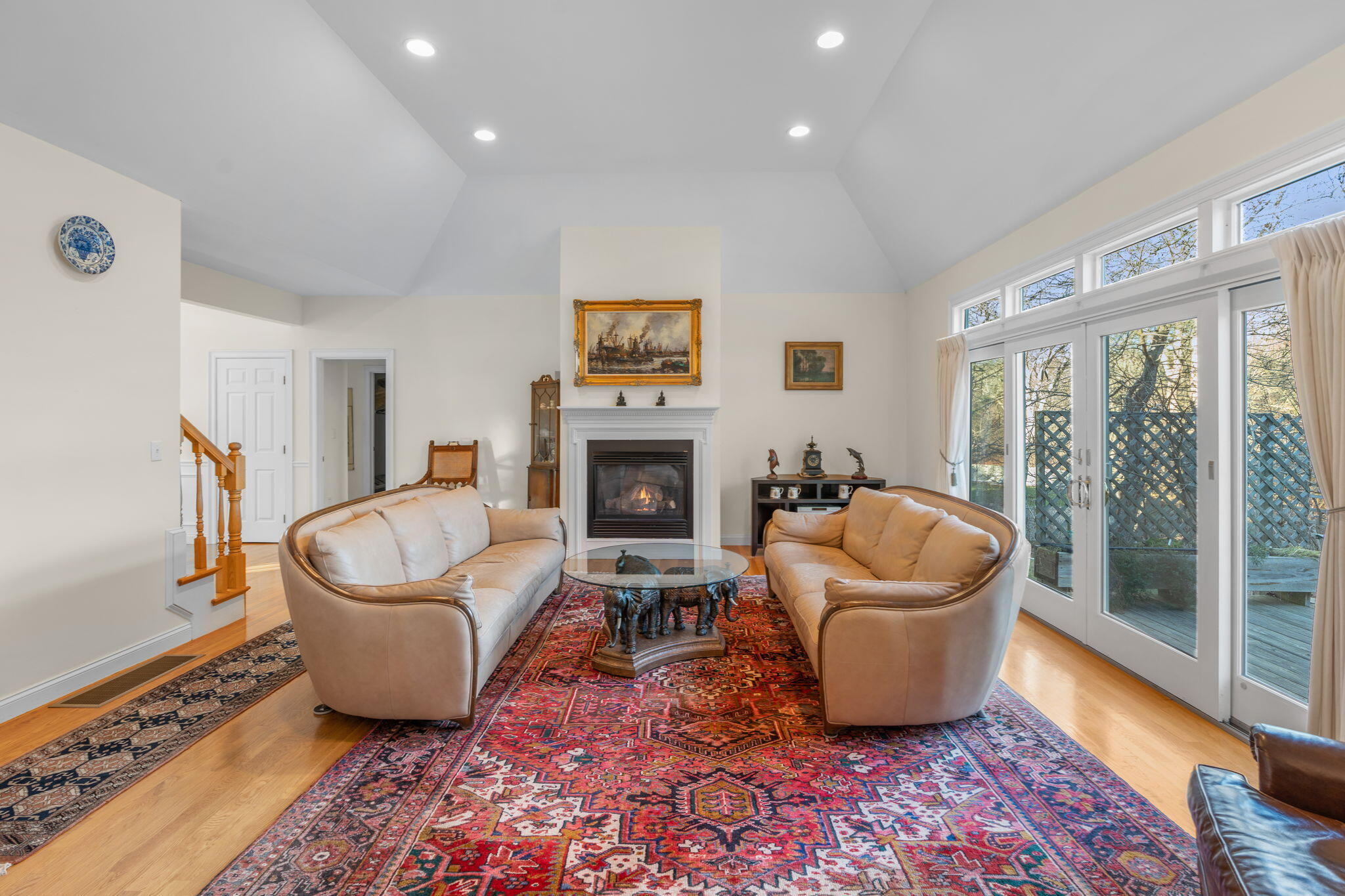 208 Rock Landing Road Mashpee, MA 02649 - Photo 10 of 32 a living room with furniture and a fireplace