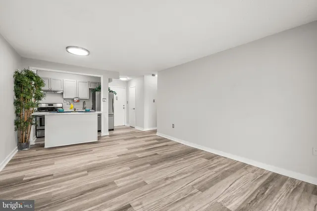 a view of a kitchen with a sink and cabinets