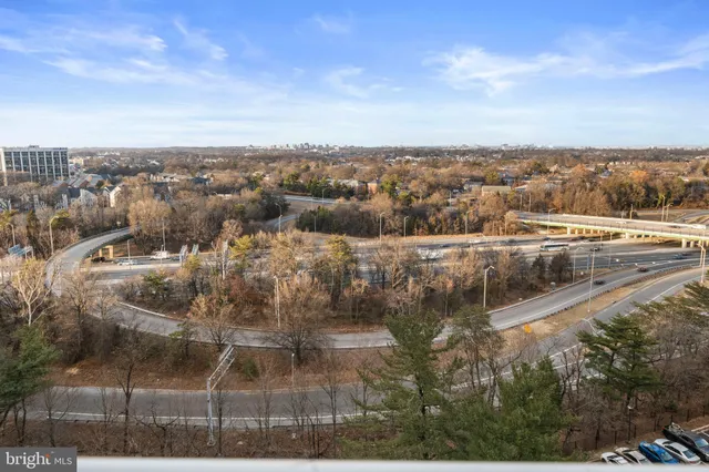 a lobby with furniture and a potted plant