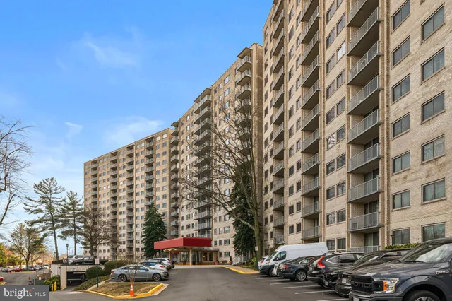a city street lined with buildings and cars