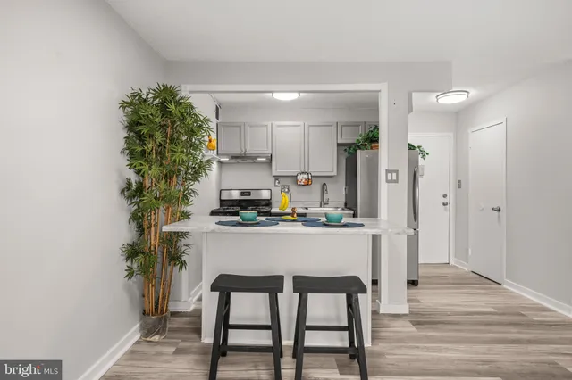 a kitchen with a table and chairs in it