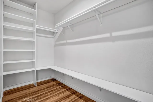 a view of an empty walk in closet