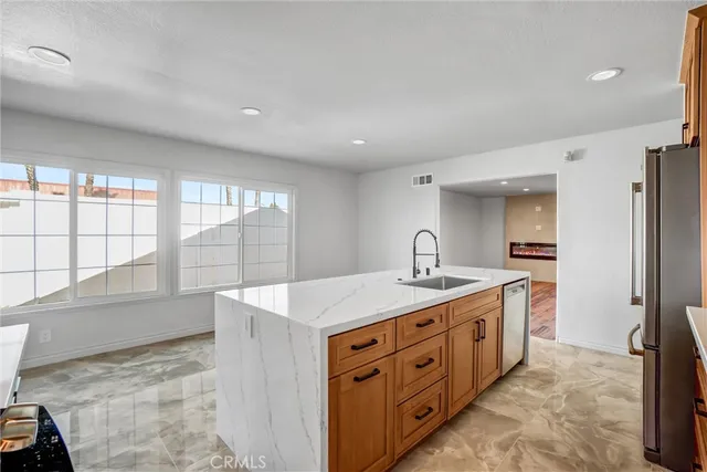 a spacious bathroom with a granite countertop sink and a large mirror