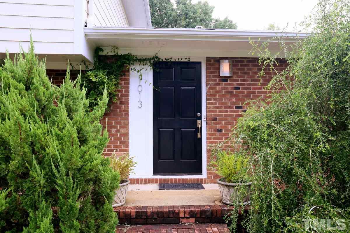 1013 Deerfield Road Raleigh, NC 27609 - Photo 23 of 25 a front view of a house with a garage