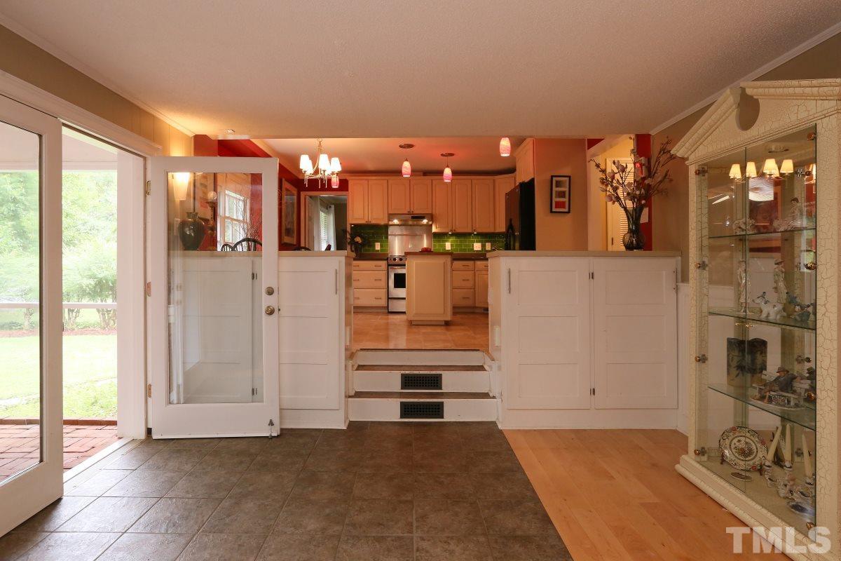 1013 Deerfield Road Raleigh, NC 27609 - Photo 9 of 25 a view of a kitchen with refrigerator and window