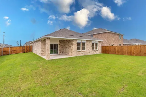 a front view of a house with yard