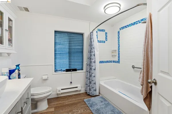 a bathroom with a sink a toilet and a bathtub