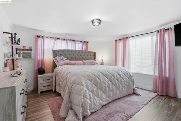 a bedroom with a bed and a cabinets