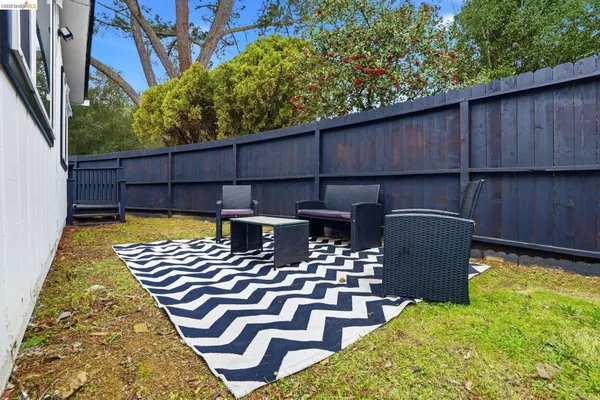 swimming pool view with a seating space
