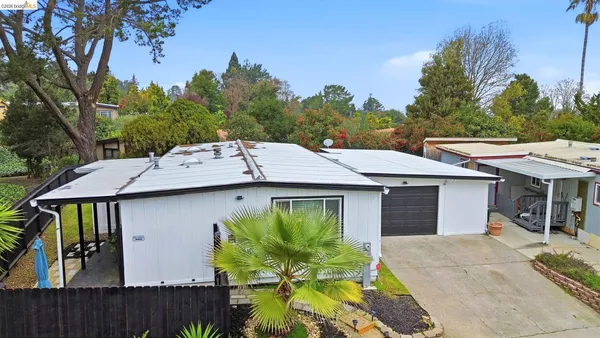 an aerial view of a house with a garden
