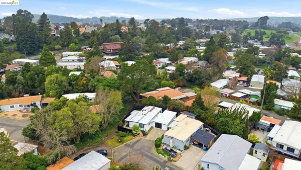 an aerial view of residential houses with outdoor space