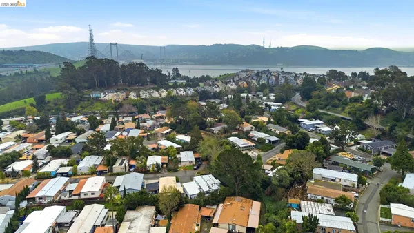 an aerial view of a house with a ocean view